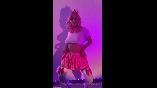 Britney slowly lowered herself to her knees, her long hair cascading down around her shoulders