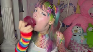 The busty blonde slowly inserts the large dildo into her mouth, taking it deep into her throat